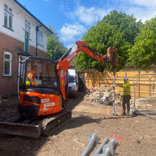 Mini piling rig installing screw pile foundations
