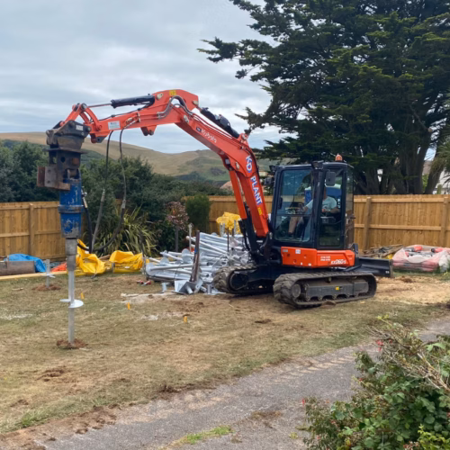 Mini piling rig installing residential foundations