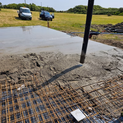 Screw pile foundation supporting concrete slab
