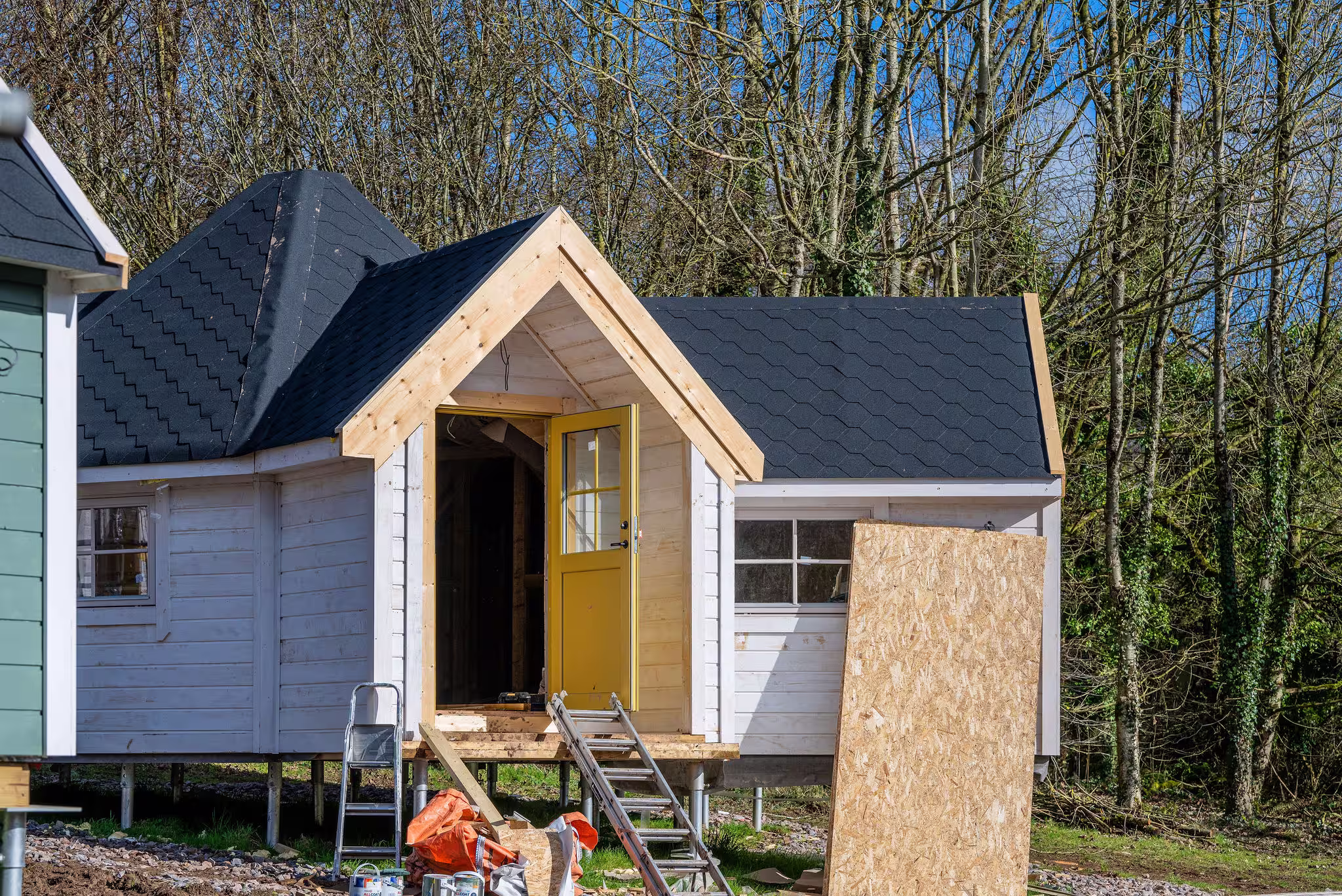 Finished timber cabin supported by screw piles